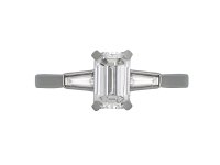  Emerald cut Diamond Flanked Solitaire Ring, circa 1950.