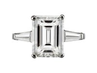 4.02 carat emerald cut diamond flanked solitaire ring, circa 1960.