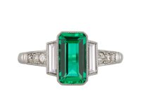 Colombian emerald diamond flanked solitaire ring hatton garden