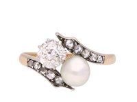 Pearl and diamond crossover ring, circa 1900. Hatton Garden