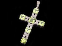 Peridot and diamond cross, circa 1920. Hatton Garden