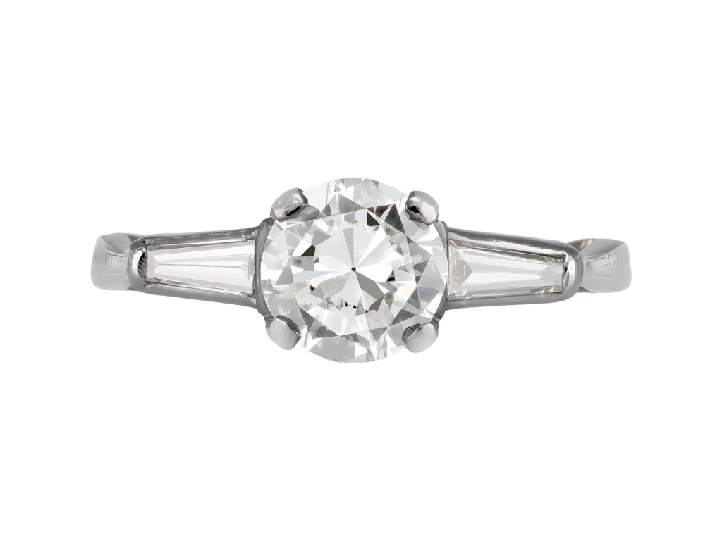 Diamond flanked solitaire ring, American, circa 1950.