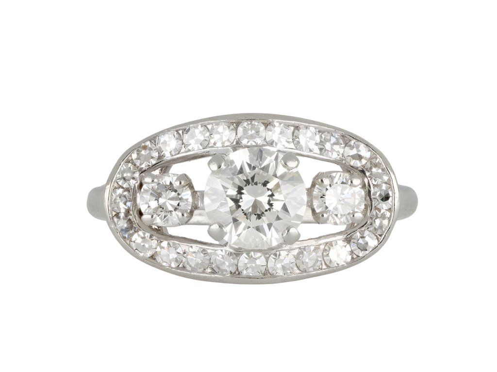 Three stone diamond cluster ring, circa 1950.