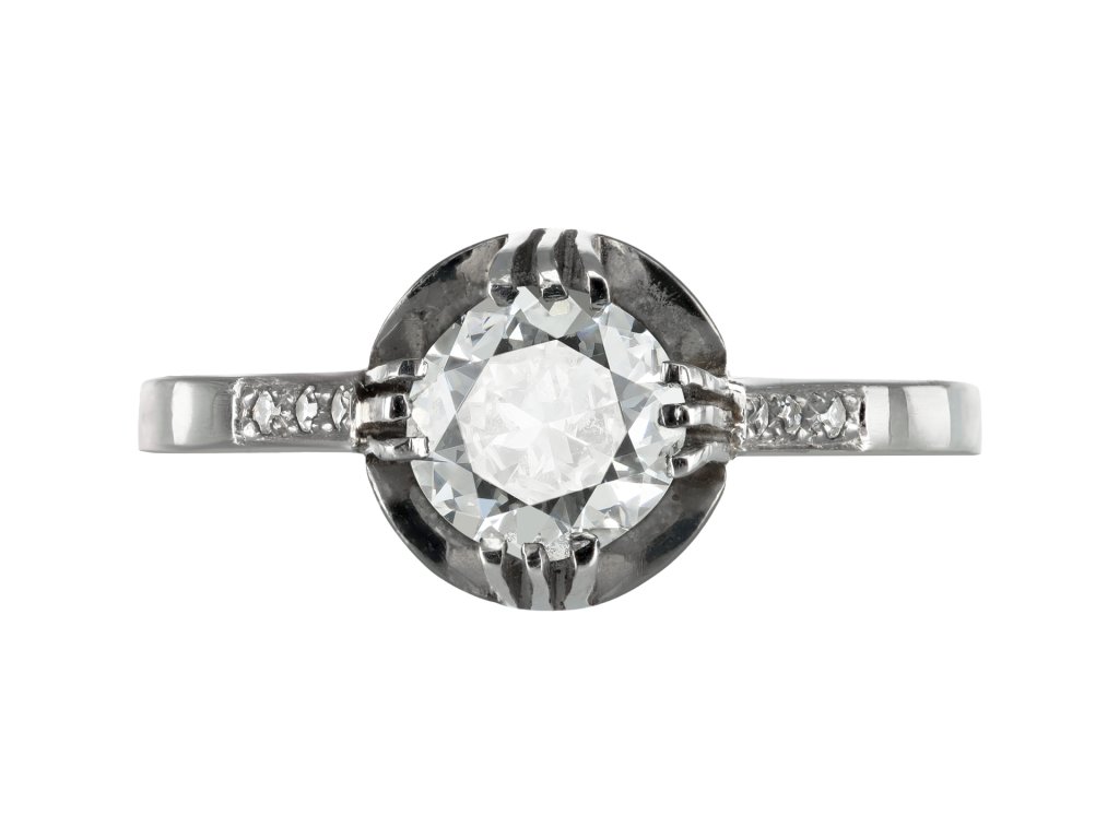 Diamond flanked solitaire ring, circa 1915.