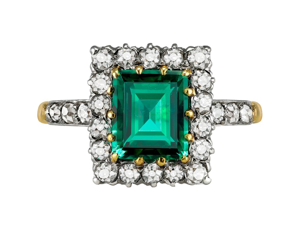 Antique emerald and diamond coronet cluster ring, early 20th Century. 