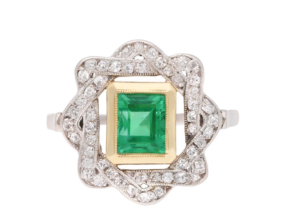 Antique emerald and diamond cluster ring, circa 1915. Hatton Garden