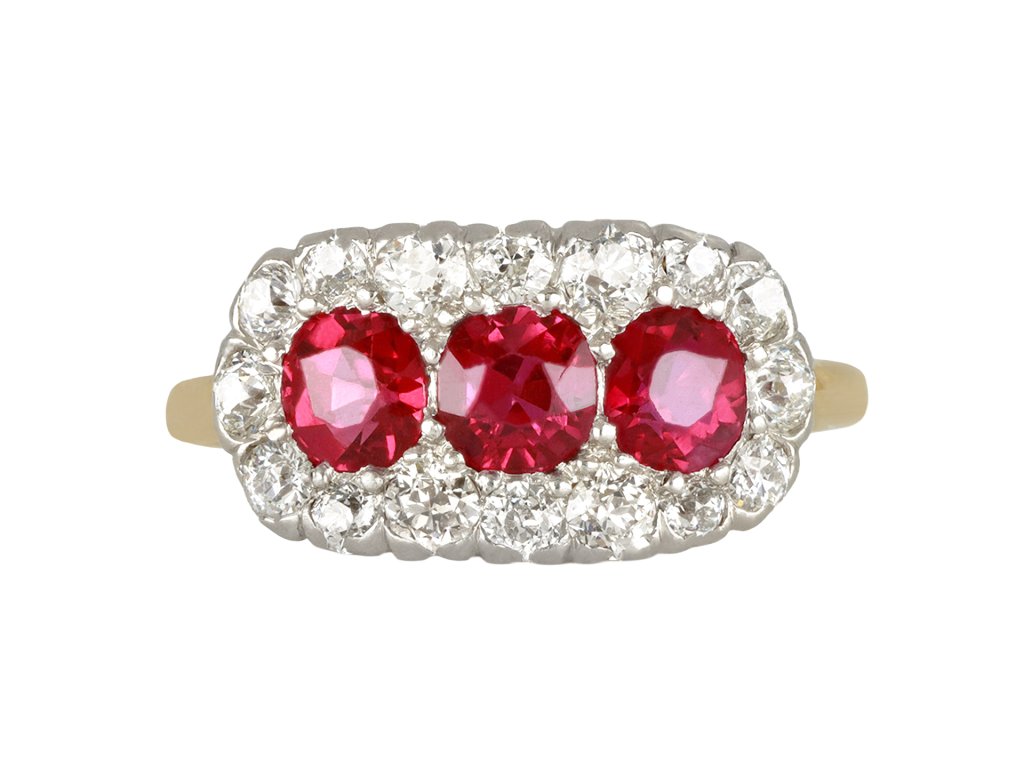 Edwardian Burmese ruby triple cluster ring, English, circa 1910.