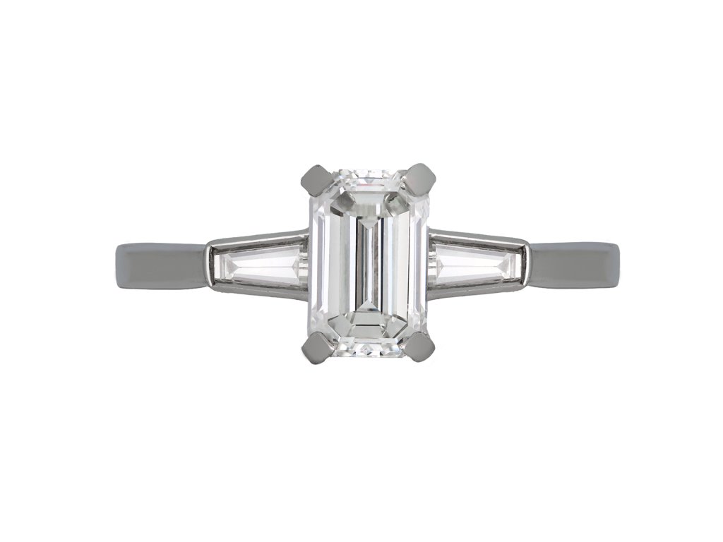  Emerald cut Diamond Flanked Solitaire Ring, circa 1950.