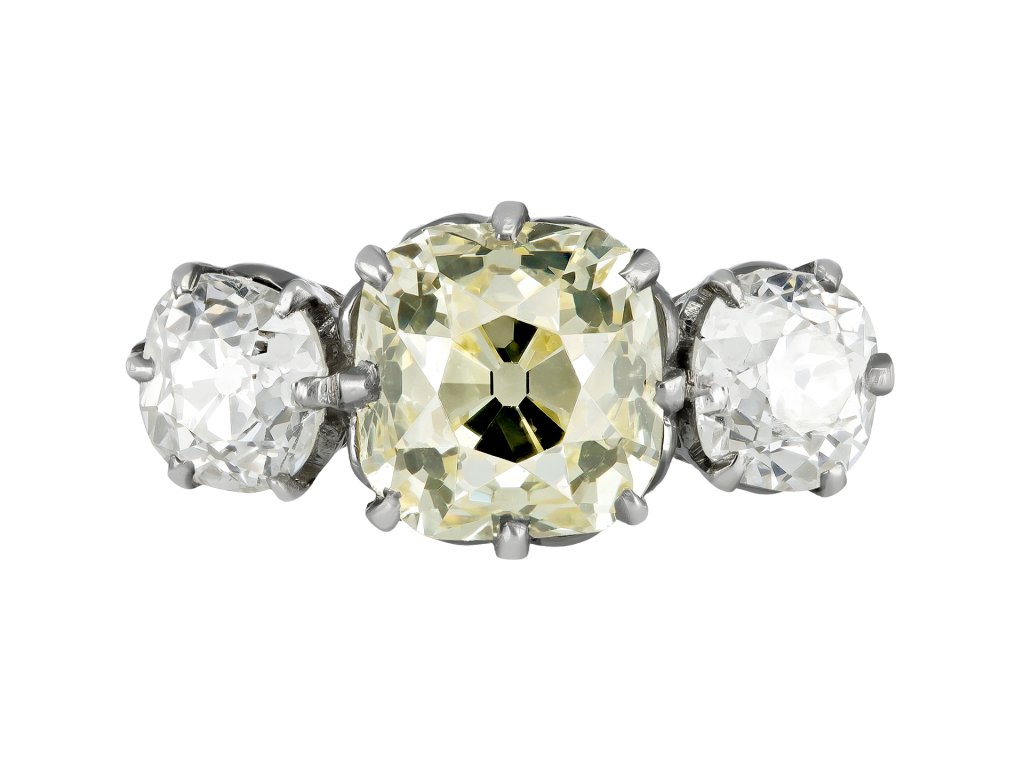 Edwardian fancy light yellow diamond three stone ring, English, circa 1910.