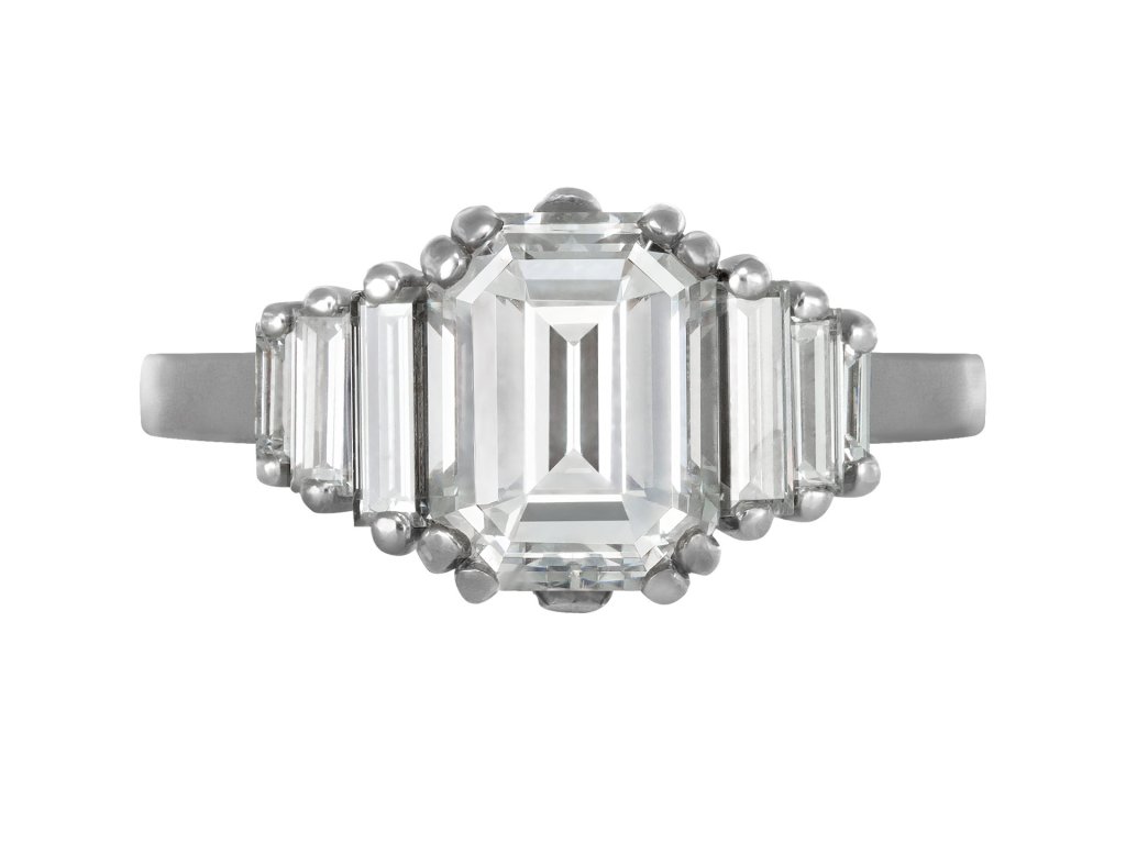 Vintage Diamond flanked solitaire ring, circa 1970.