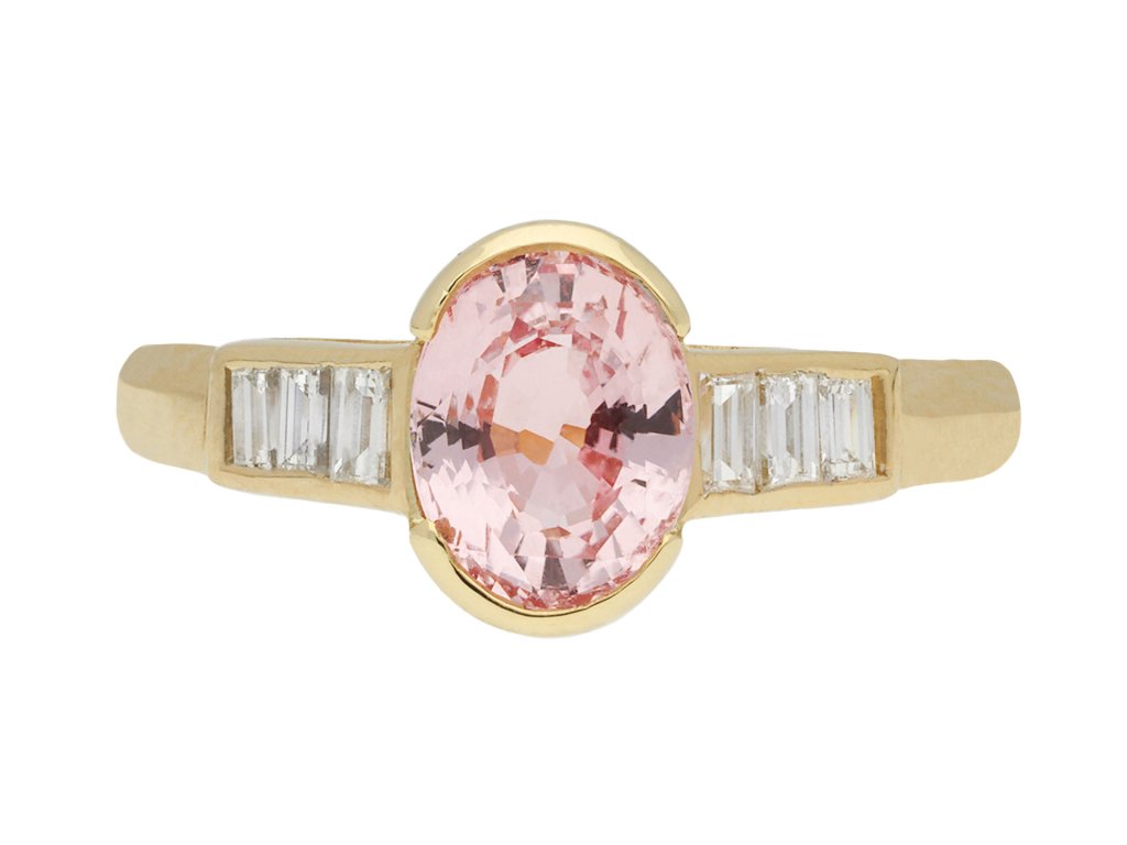Pink Ceylon sapphire and diamond flanked solitaire ring, circa 1970. Hatton Garden