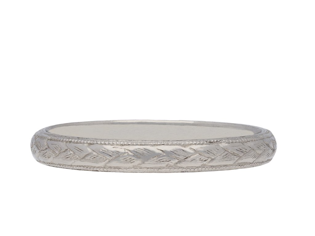 Engraved platinum wedding band, circa 1910. Hatton Garden