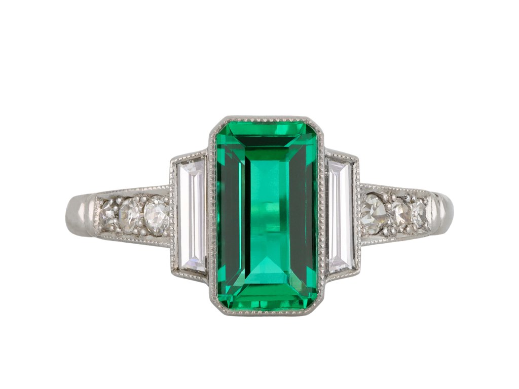 Colombian emerald diamond flanked solitaire ring hatton garden