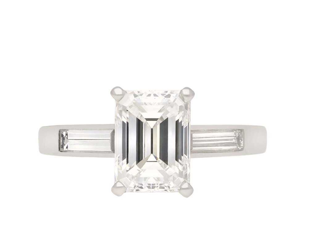 Tiffany & Co. diamond flanked solitaire ring. Hatton Garden