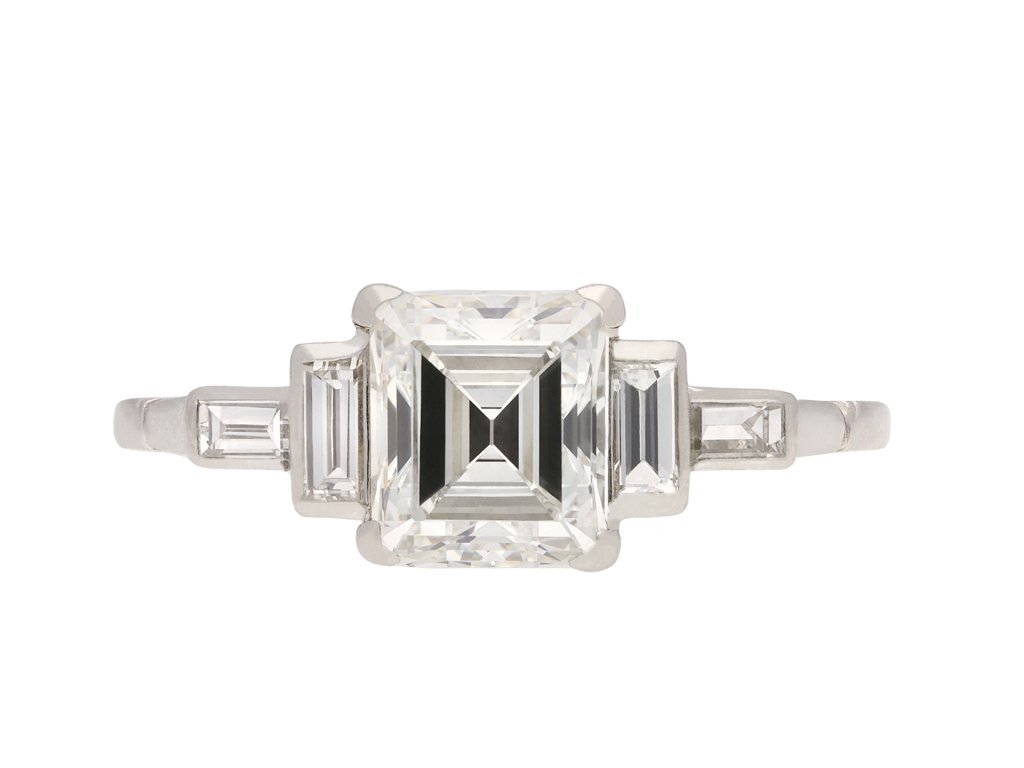 Art Deco diamond flanked solitaire ring, circa 1920. Hatton Garden