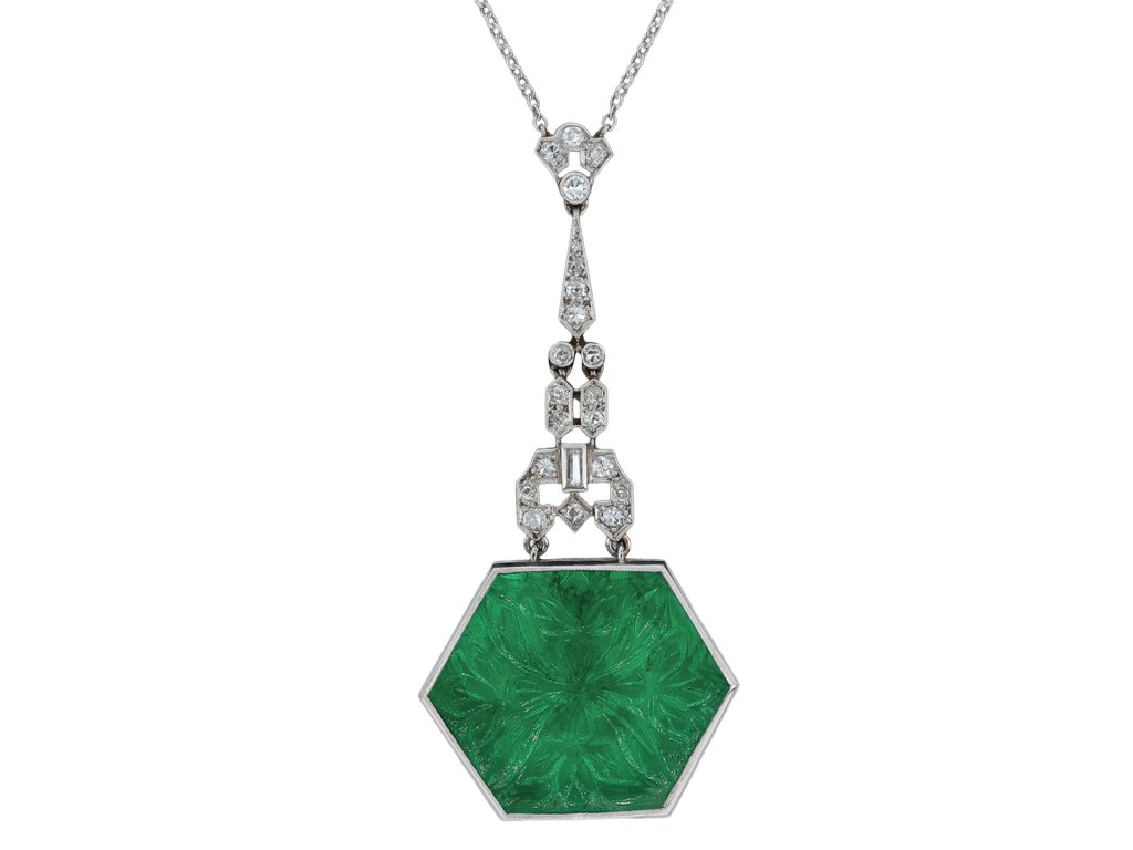 Carved emerald and diamond pendant, circa 1925. 