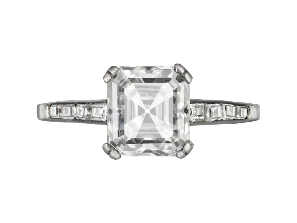 Asscher cut diamond flanked solitaire ring, circa 1930. 