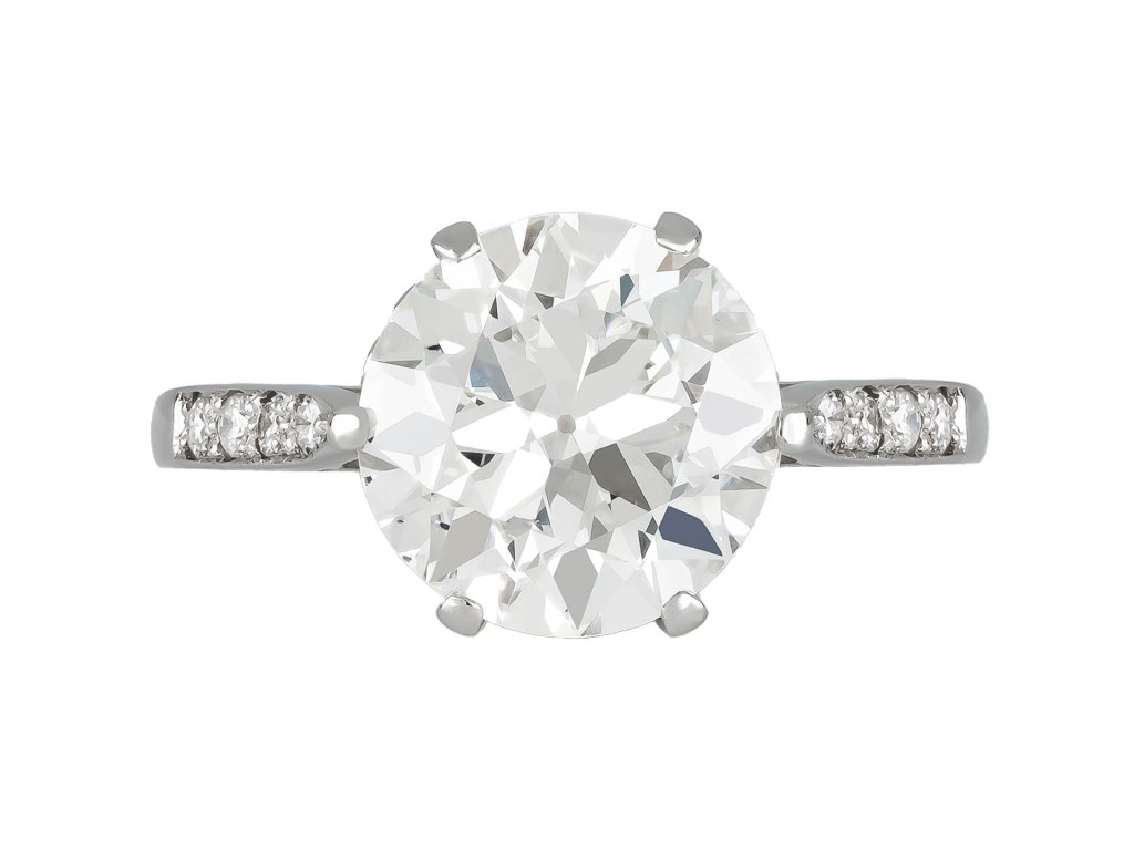 Old Cut diamond flanked solitaire ring, circa 1915.