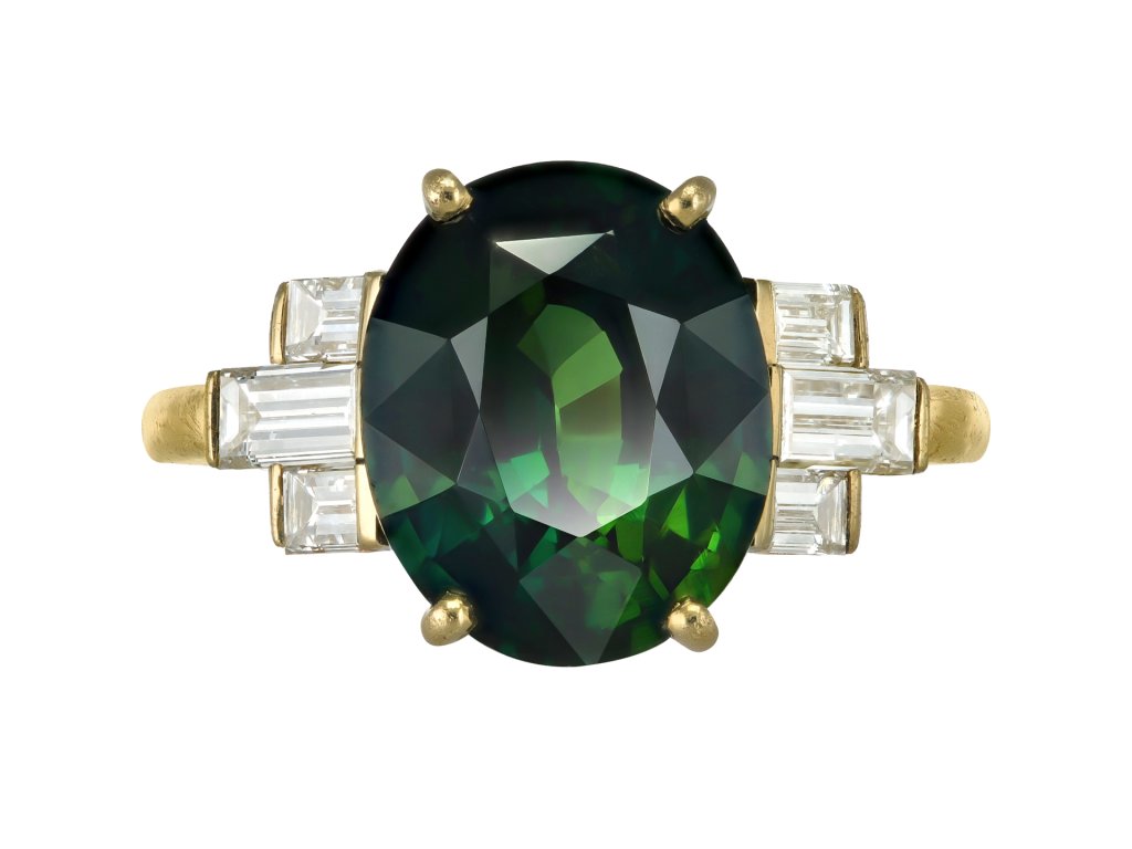 Green sapphire and diamond flanked solitaire ring. 