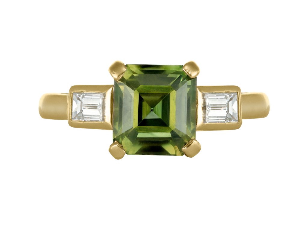 Green sapphire and diamond flanked solitaire ring, circa 1980. 