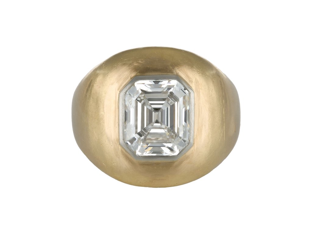 Emerald cut diamond gypsy ring, circa 1970.