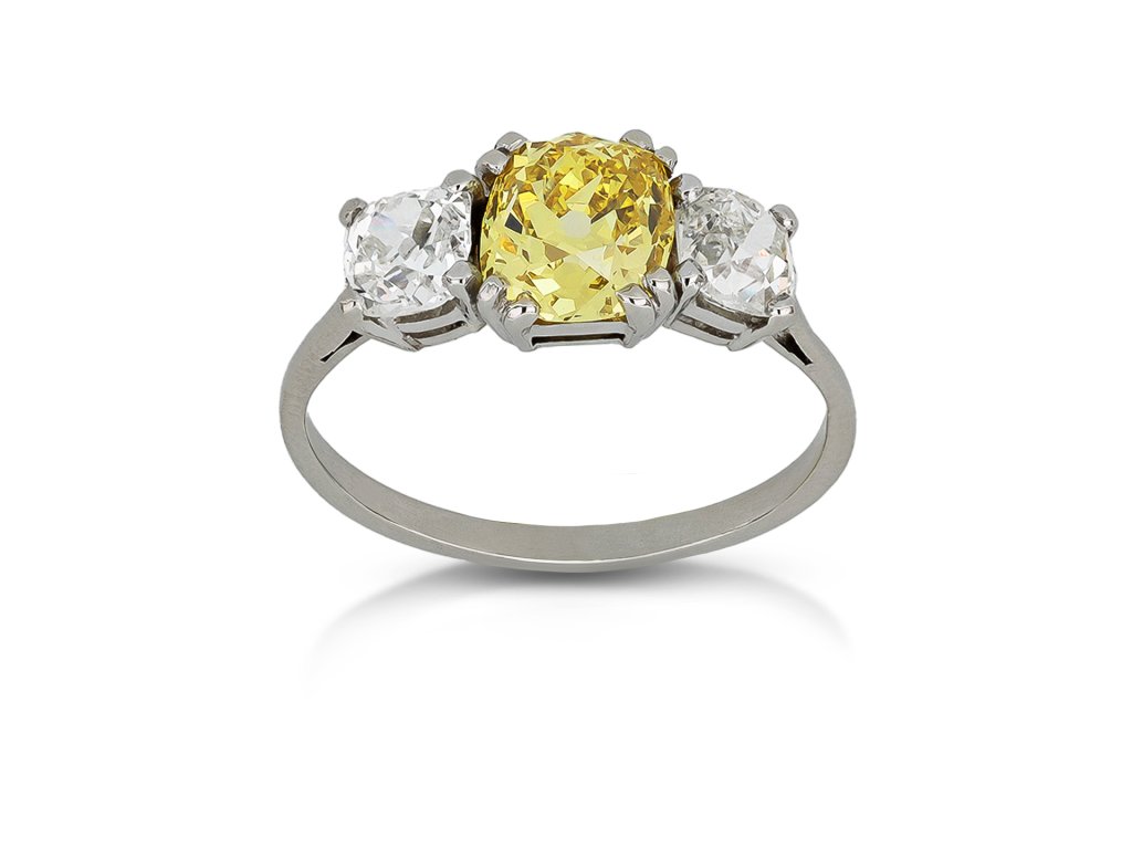 Fancy intense yellow diamond three stone ring, circa 1915