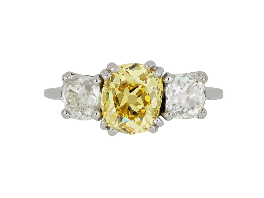 Fancy intense yellow diamond three stone ring, circa 1915