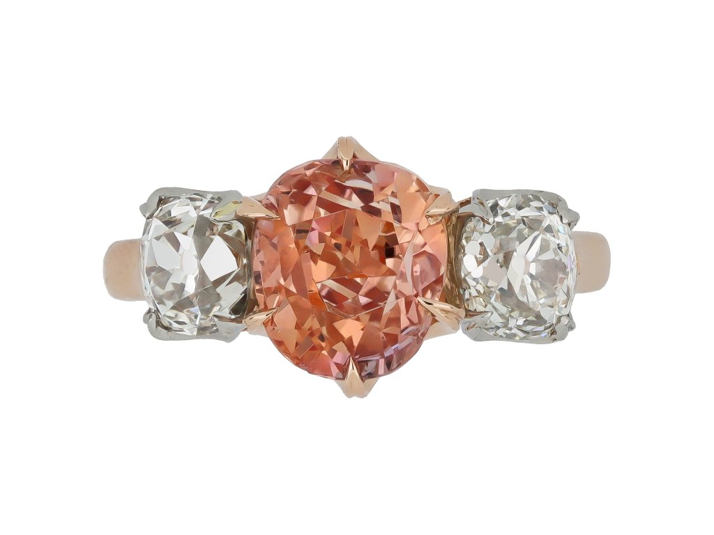 Padparadscha Ceylon sapphire and diamond three stone ring.