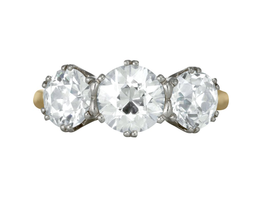 Old cut diamond three stone ring, circa 1910. 
