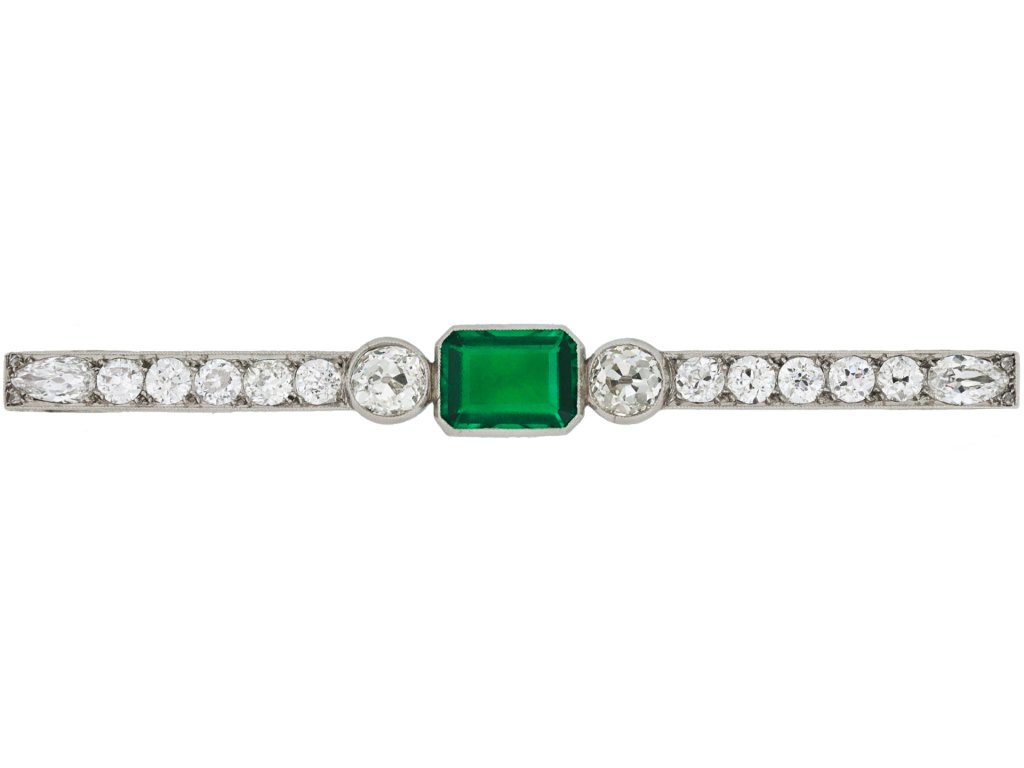 Colombian emerald and diamond bar brooch, circa 1920. 