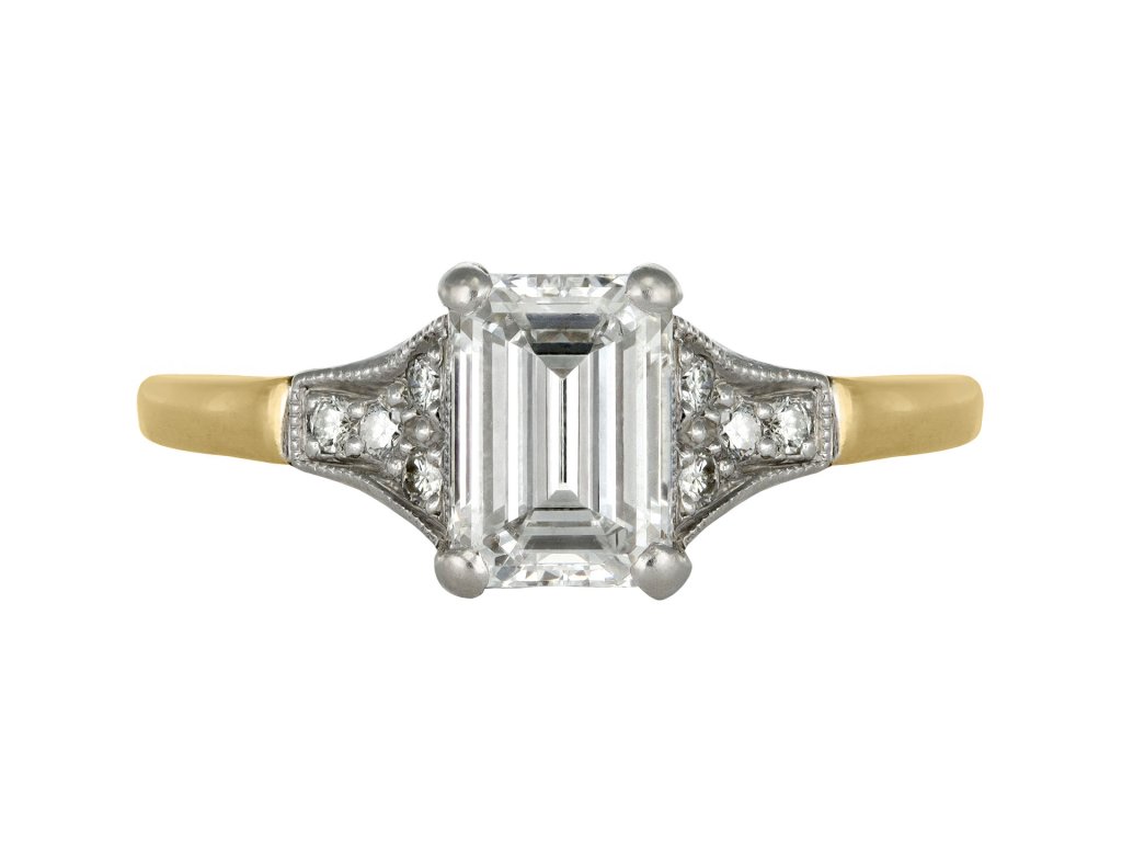 A diamond ring featuring an emerald cut centre stone