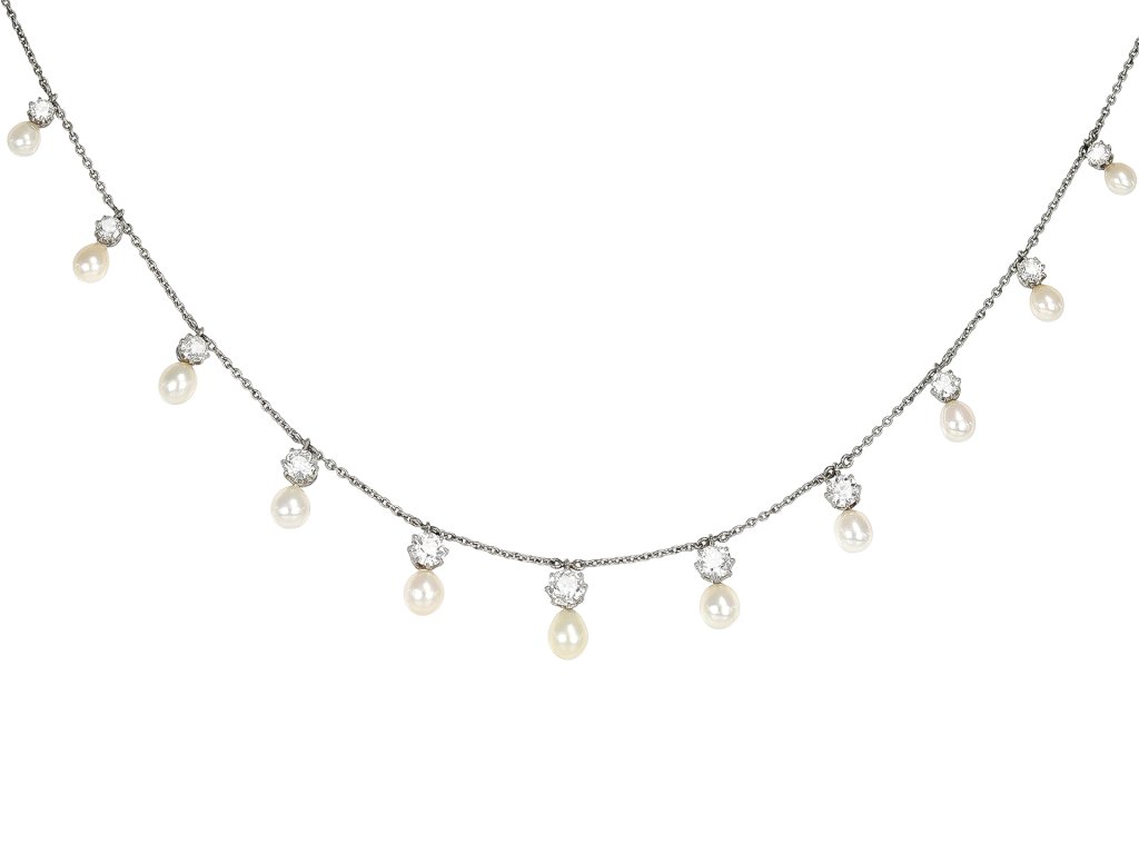 Natural pearl and diamond necklace, circa 1910. 