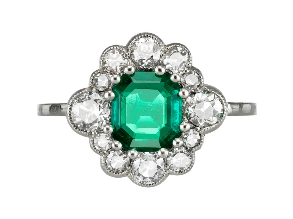 Emerald and diamond cluster ring, circa 1920. 