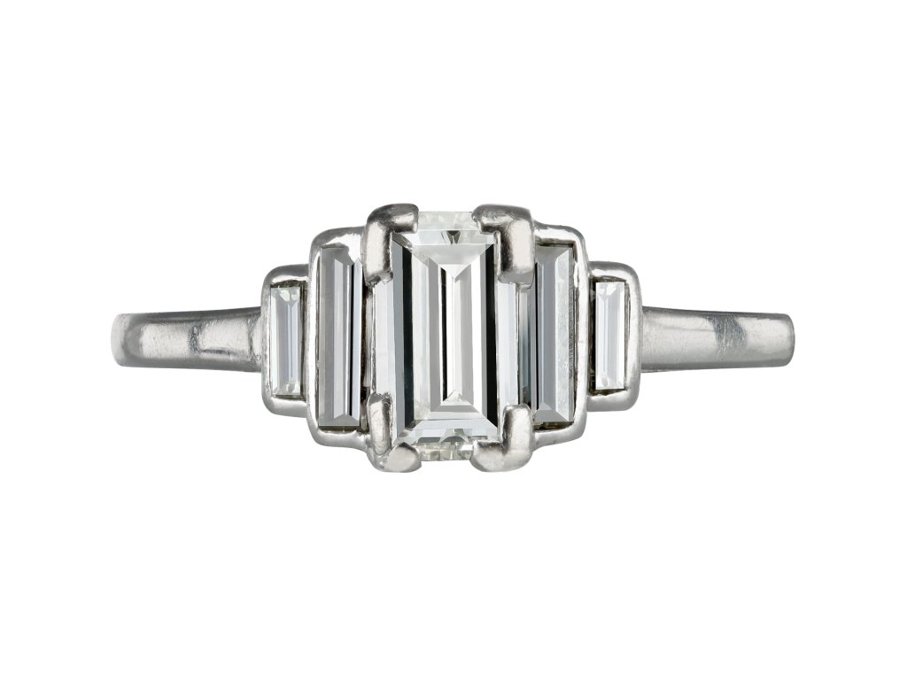 Art Deco diamond flanked solitaire ring, 1935. 