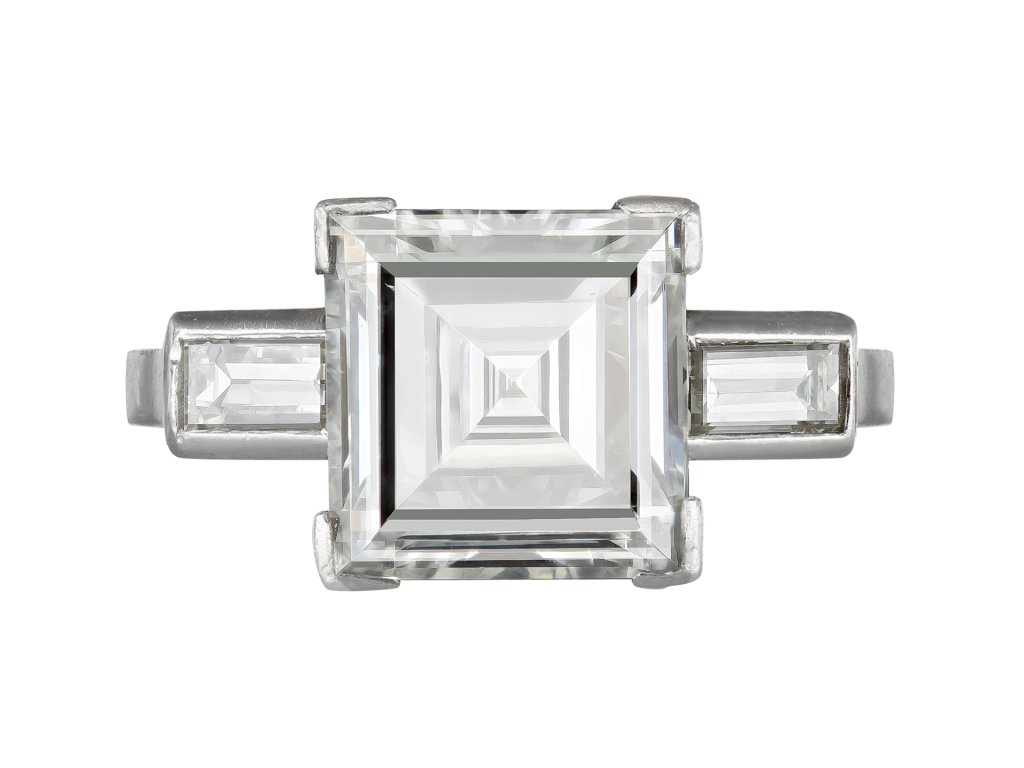 Diamond flanked solitaire, circa 1920. 