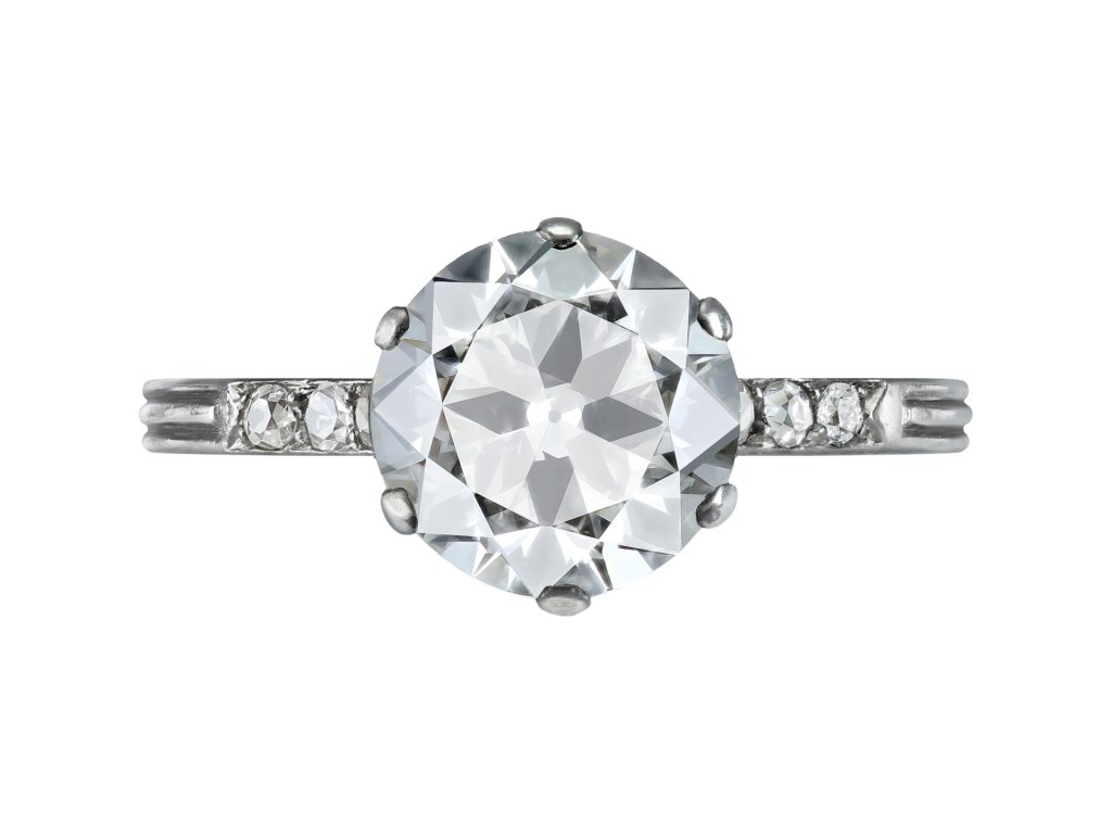 Old cut diamond flanked solitaire ring, circa 1920. 