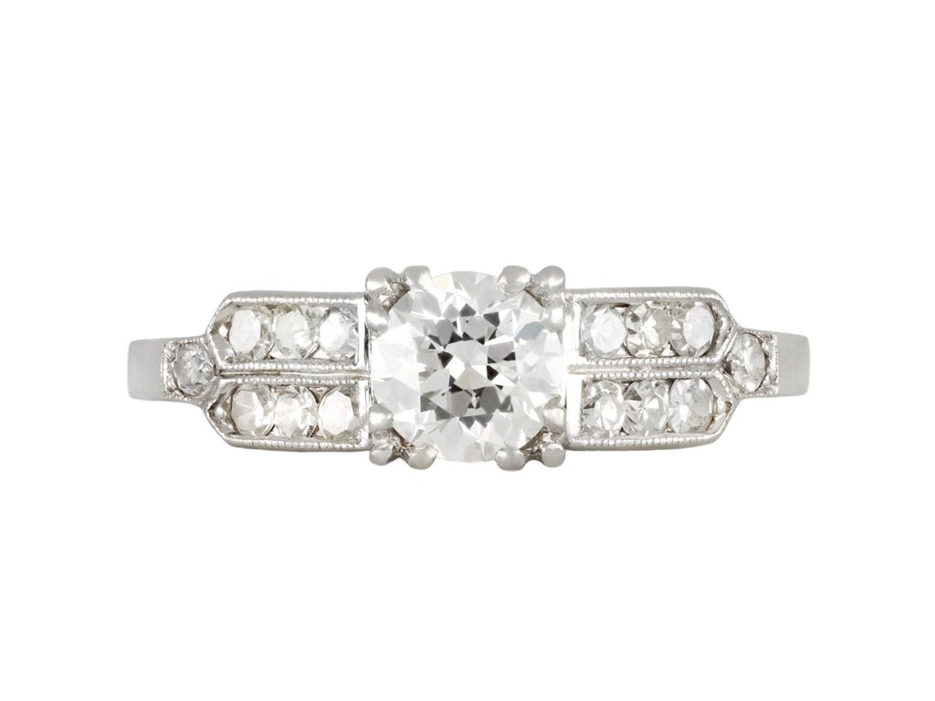 Diamond flanked solitaire ring, American, circa 1940.