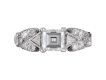 Vintage diamond flanked solitaire ring, circa 1950.