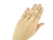 hand view Gold posy ring with carved detailing, 'It is my love'
