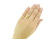 hand view gold posy ring berganza hatton garden 