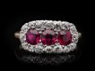 Edwardian Burmese ruby triple cluster ring, English, circa 1910.