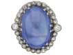 Cabochon Ceylon sapphire and diamond coronet cluster ring, circa 1920.