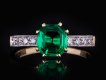 Colombian emerald diamond flanked solitaire ring hatton garden