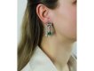 Pederzani Colombian emerald diamond drop earrings hatton garden