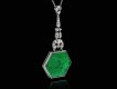 Carved emerald and diamond pendant, circa 1925. 