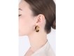 Kutchinsky tiger's eye earrings, English, 1972.