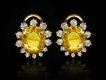 Yellow Ceylon sapphire and diamond cluster earrings, circa 1960.
