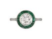 Diamond and emerald target ring, French, circa 1920. 