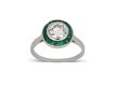 Diamond and emerald target ring, French, circa 1920. 
