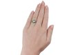 Diamond and emerald target ring, French, circa 1920. 